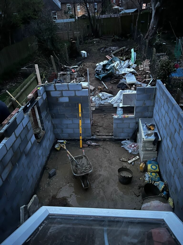 Blockwork walls under construction for a new rear extension